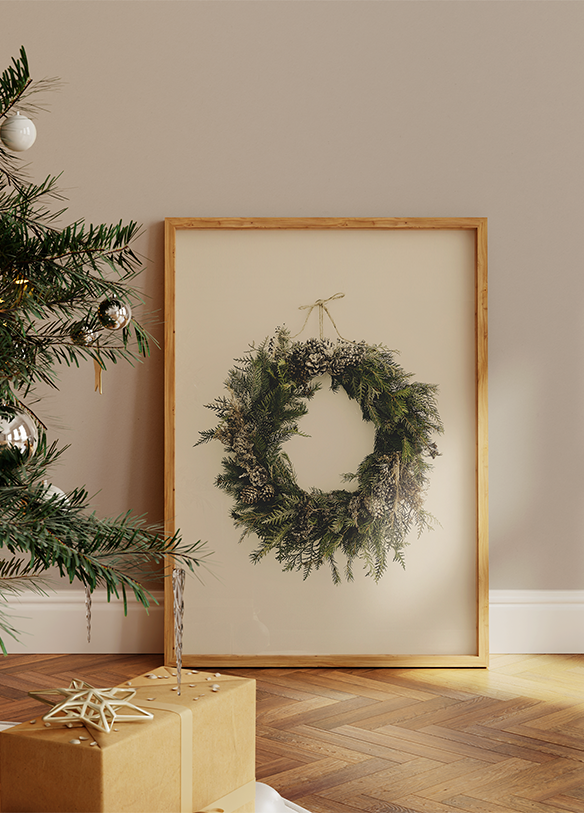 a picture of a christmas wreath hanging on a wall