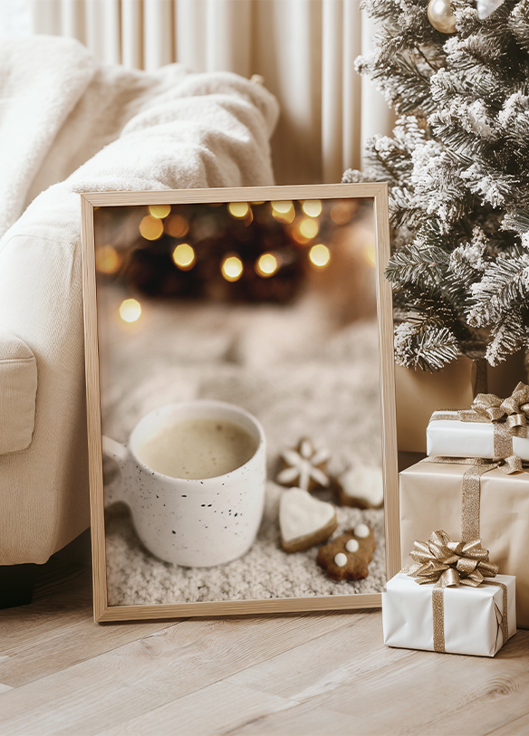 a picture of a cup of coffee next to a christmas tree