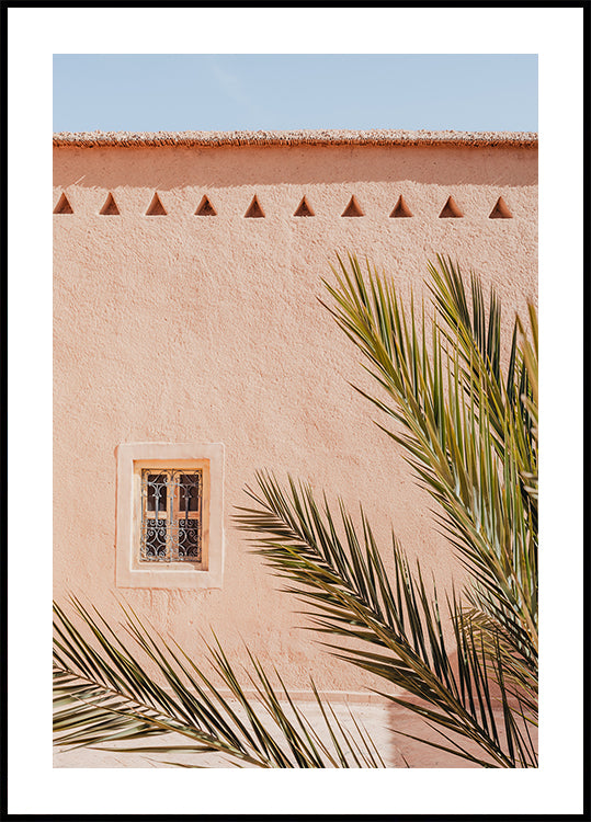 Palm leaves and a clay building in Morocco Plakat