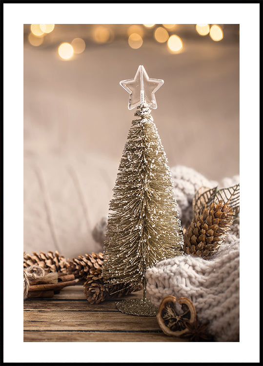 a small christmas tree sitting on top of a wooden table