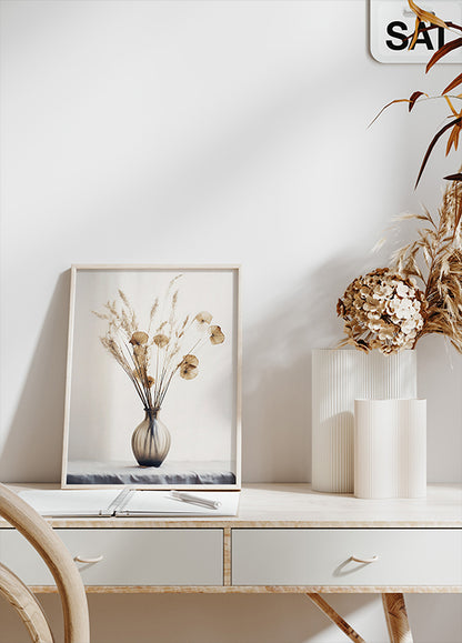 a white desk with a vase of flowers on it