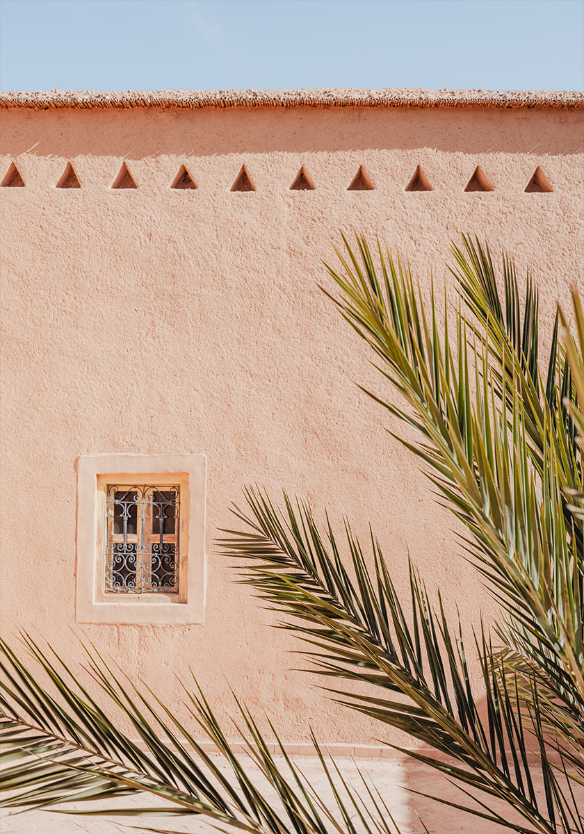 Palm leaves and a clay building in Morocco Plakat