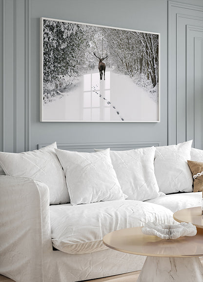 a living room filled with furniture and a painting on the wall