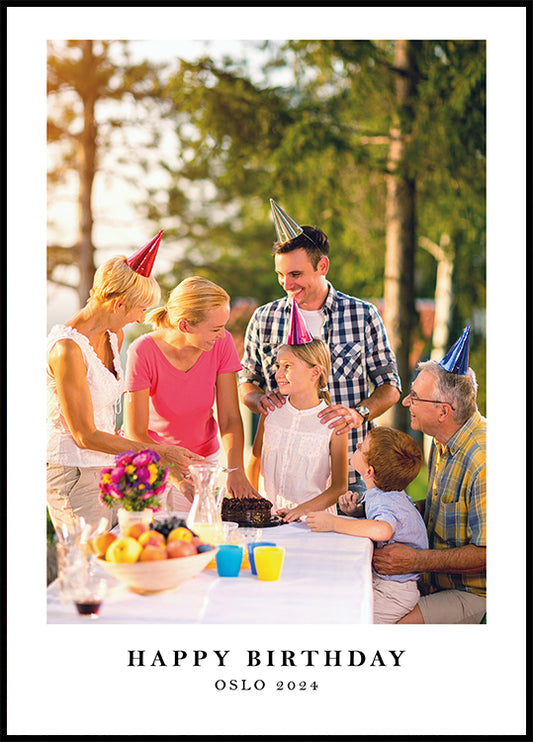 a family celebrating a birthday with a cake