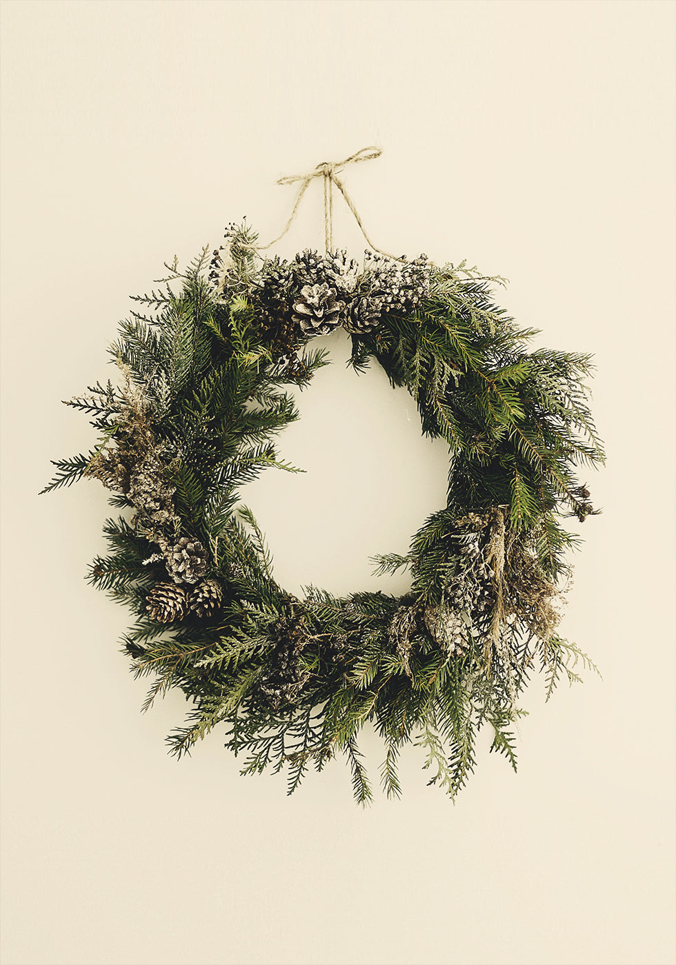 a christmas wreath hanging on a wall