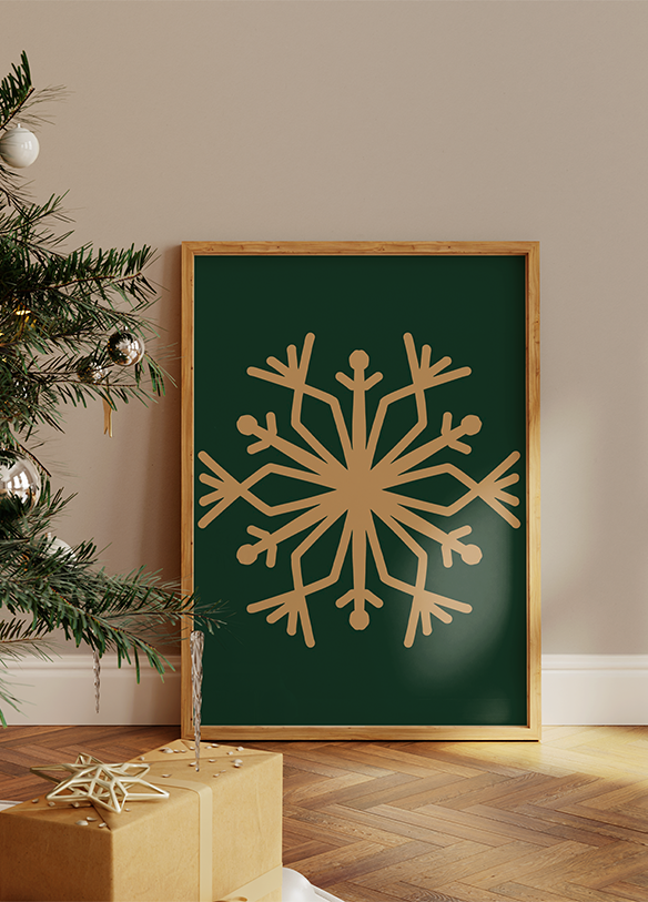 a picture of a snowflake on a wall next to a christmas tree