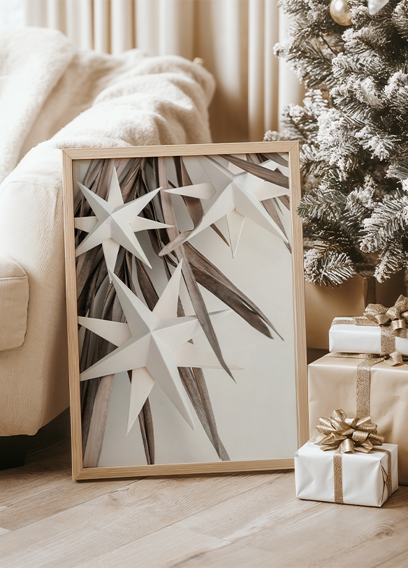 a picture frame sitting next to a christmas tree