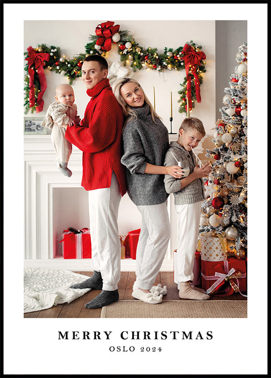 a family standing in front of a christmas tree